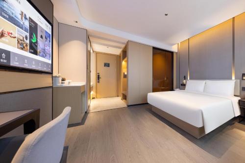 Imagen de la habitación del Hotel Atour Zhongshan Nantou Haiya Colorful City. Foto 19