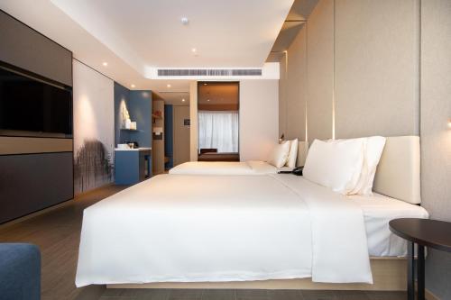 Imagen de la habitación del Hotel Atour Zhongshan North Station V-PARK Plaza. Foto 12