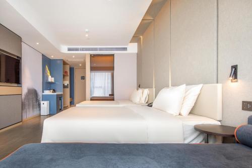 Imagen de la habitación del Hotel Atour Zhongshan North Station V-PARK Plaza. Foto 16