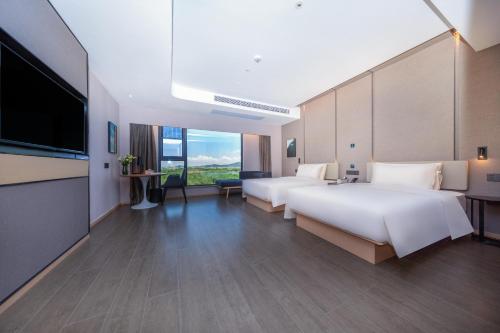 Imagen de la habitación del Hotel Atour Zhuhai High Tech Zone University Town Government Affairs Center. Foto 11