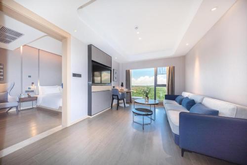 Imagen de la habitación del Hotel Atour Zhuhai High Tech Zone University Town Government Affairs Center. Foto 13
