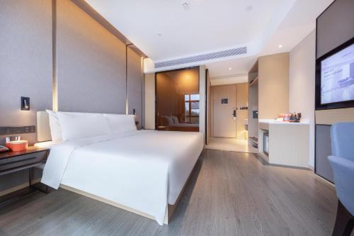 Imagen de la habitación del Hotel Atour Zhuhai Tangjiawan University Jinding Plaza. Foto 11