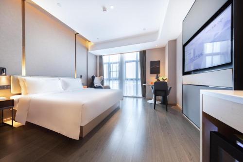Imagen de la habitación del Hotel Atour Zhuhai Tangjiawan University Jinding Plaza. Foto 12