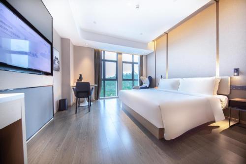 Imagen de la habitación del Hotel Atour Zhuhai Tangjiawan University Jinding Plaza. Foto 13