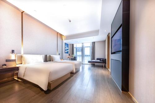 Imagen de la habitación del Hotel Atour Zhuhai Tangjiawan University Jinding Plaza. Foto 14
