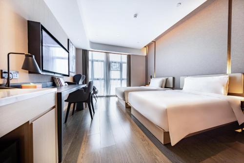 Imagen de la habitación del Hotel Atour Zhuhai Tangjiawan University Jinding Plaza. Foto 15
