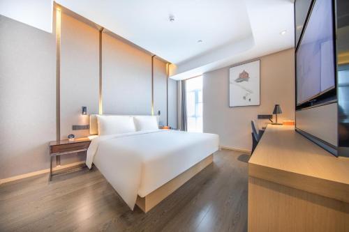 Imagen de la habitación del Hotel Atour Zhuhai Tangjiawan University Jinding Plaza. Foto 18
