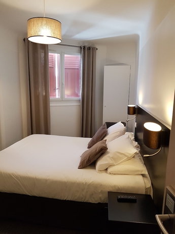 Imagen de la habitación del Hotel Au Bon Coin. Foto 9