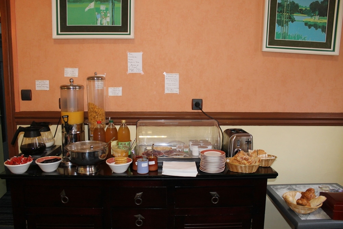 Imagen del bar/restaurante del Hotel Au Chapon Fin. Foto 4