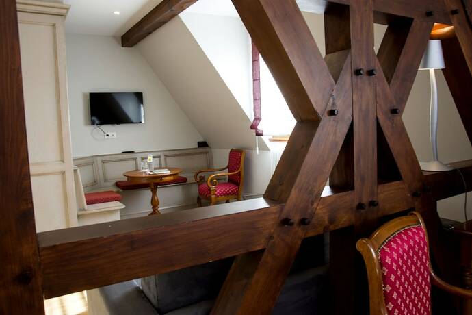 Imagen de la habitación del Hotel Au Chasseur. Foto 17