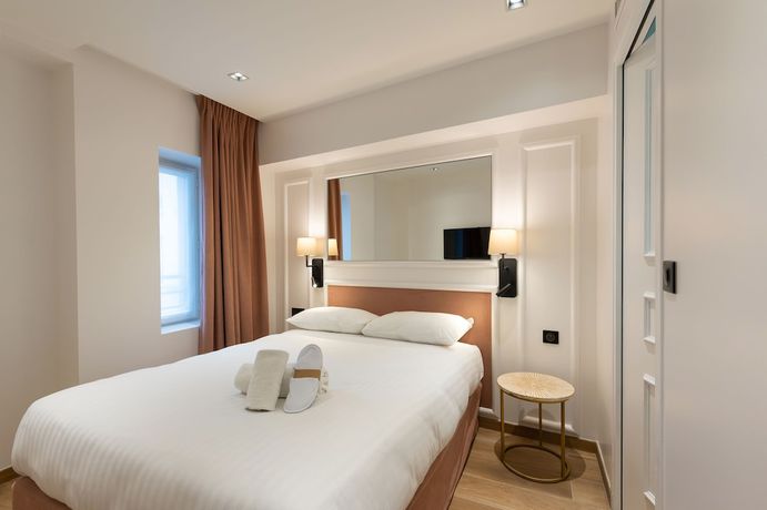 Imagen de la habitación del Hotel Au Coeur De Republique. Foto 5