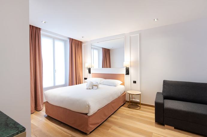 Imagen de la habitación del Hotel Au Coeur De Republique. Foto 11