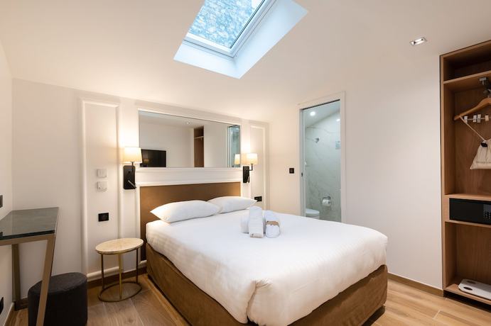 Imagen de la habitación del Hotel Au Coeur De Republique. Foto 12