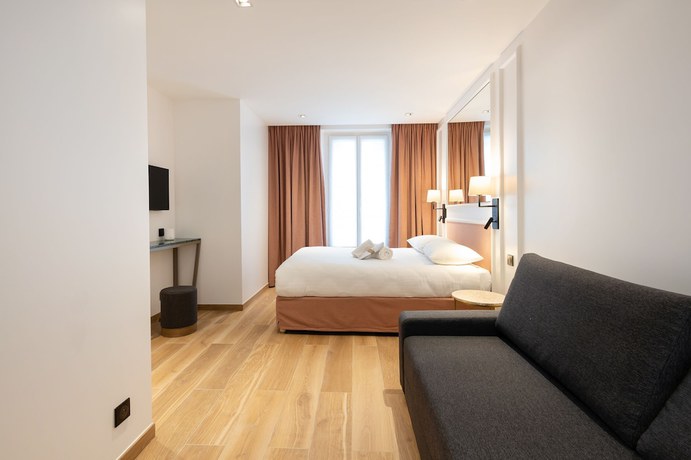 Imagen de la habitación del Hotel Au Coeur De Republique. Foto 16