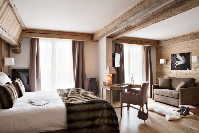 Imagen de la habitación del Hotel Au Coeur Du Village. Foto 2