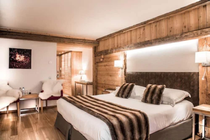 Imagen de la habitación del Hotel Au Coeur Du Village. Foto 7