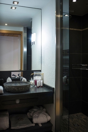 Imagen de la habitación del Hotel Au Coeur Du Village. Foto 8