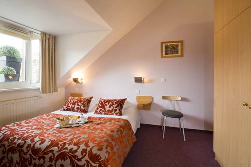 Imagen de la habitación del Hotel Au Cygne. Foto 3