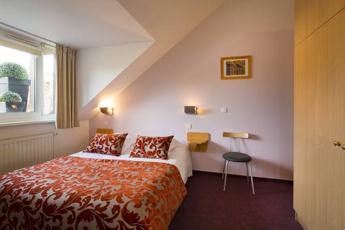 Imagen de la habitación del Hotel Au Cygne. Foto 10