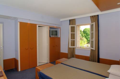 Imagen de la habitación del Hotel Au Logis Des Remparts. Foto 7