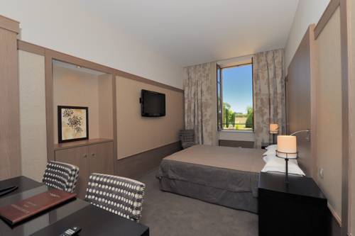 Imagen de la habitación del Hotel Au Logis Des Remparts. Foto 10