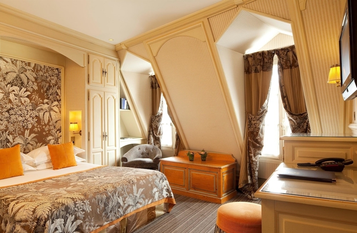 Imagen de la habitación del Hotel Au Manoir Saint-germain. Foto 12