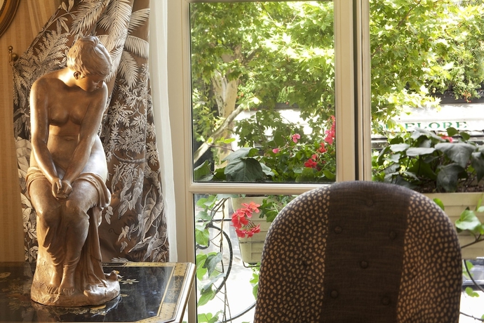 Imagen de la habitación del Hotel Au Manoir Saint-germain. Foto 16