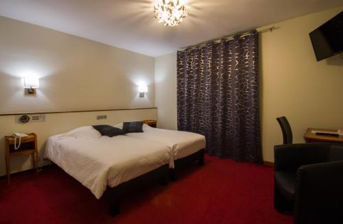 Imagen de la habitación del Hotel Au Nid De Cigognes. Foto 4