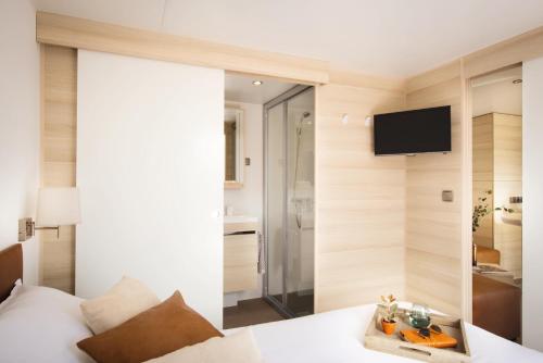 Imagen de la habitación del Hotel Au Paradis des Campeurs. Foto 7