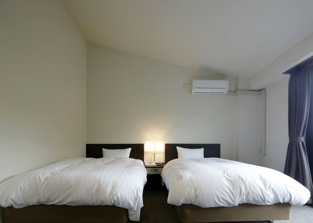 Imagen de la habitación del Hotel Auberge Cosmos. Foto 15