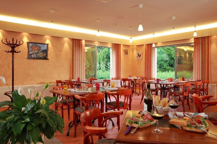 Imagen del bar/restaurante del Hotel Auberge Du Parc. Foto 11