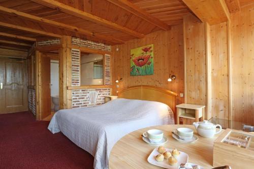 Imagen de la habitación del Hotel Auberge La Meuniere. Foto 3