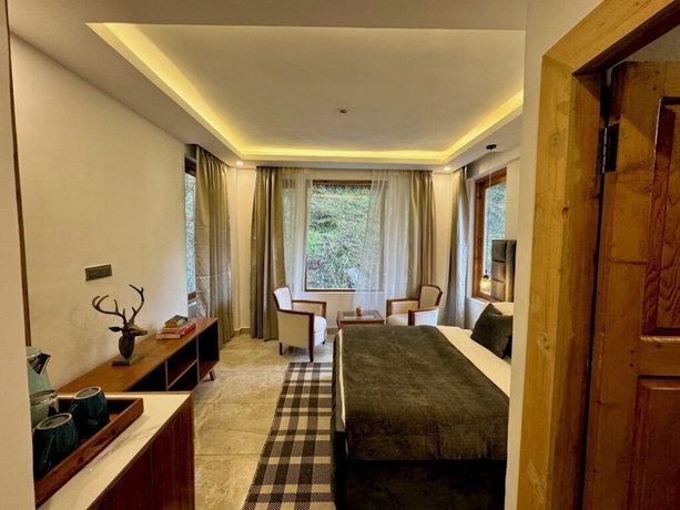 Imagen de la habitación del Hotel Ausnya Tirthan. Foto 4