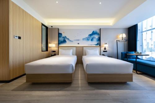 Imagen de la habitación del Hotel Ausotel by Argyle Baiyun Airport Renhe MTR. Foto 16