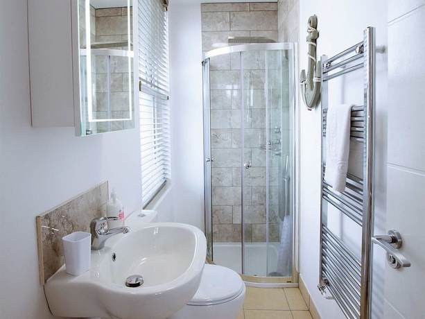 Imagen de la habitación del Hotel Austen\'s Luxury Apartments. Foto 18