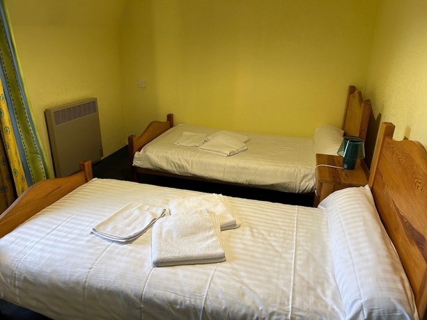 Imagen de la habitación del Hotel Aux Globe-Trotters. Foto 4