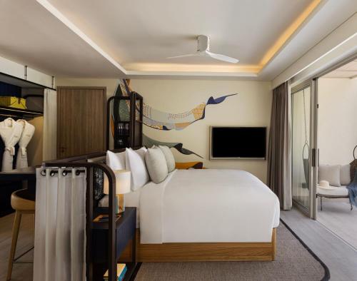 Imagen de la habitación del Hotel Avani+ Fares Maldives Resort. Foto 6