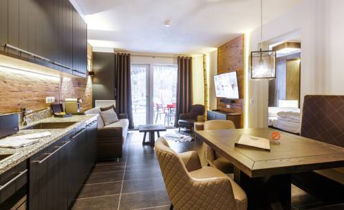 Imagen de la habitación del Hotel Avenida Mountain Lodges Saalbach. Foto 10