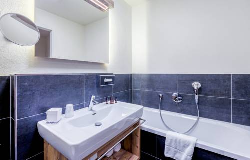 Imagen de la habitación del Hotel Avenida Mountain Lodges Saalbach. Foto 11