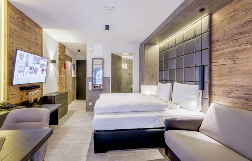 Imagen de la habitación del Hotel Avenida Mountain Lodges Saalbach. Foto 12