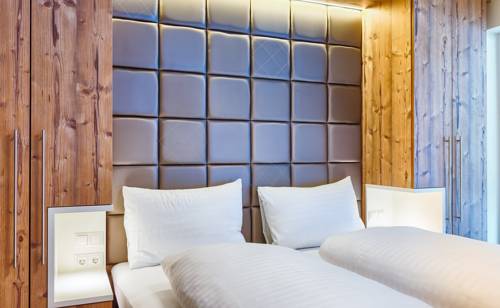 Imagen de la habitación del Hotel Avenida Mountain Lodges Saalbach. Foto 14