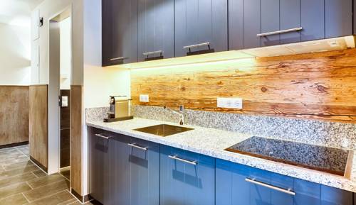 Imagen de la habitación del Hotel Avenida Mountain Lodges Saalbach. Foto 15