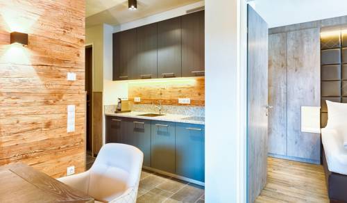 Imagen de la habitación del Hotel Avenida Mountain Lodges Saalbach. Foto 16