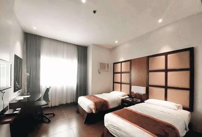 Imagen de la habitación del Hotel Avenue Suites Hotel. Foto 17