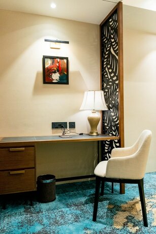 Imagen de la habitación del Hotel Avinash International. Foto 19