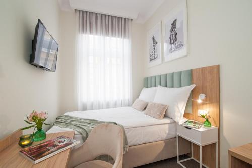 Imagen de la habitación del Hotel Awo. Foto 11