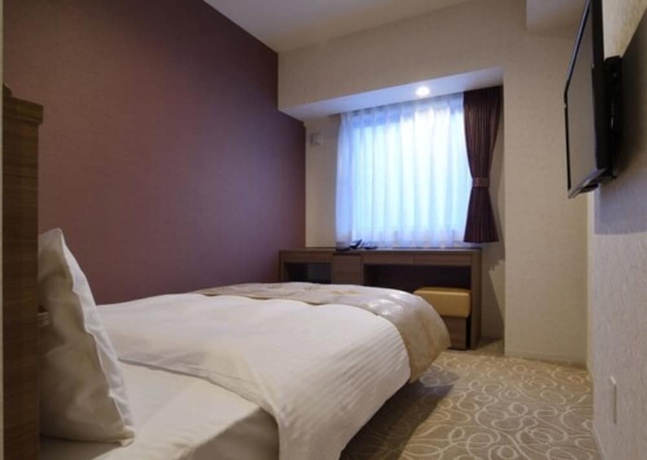 Imagen de la habitación del Hotel Axia Inn Sapporo Susukino. Foto 11