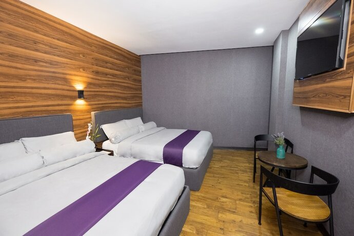 Imagen de la habitación del Hotel Axiaa Hotel. Foto 23