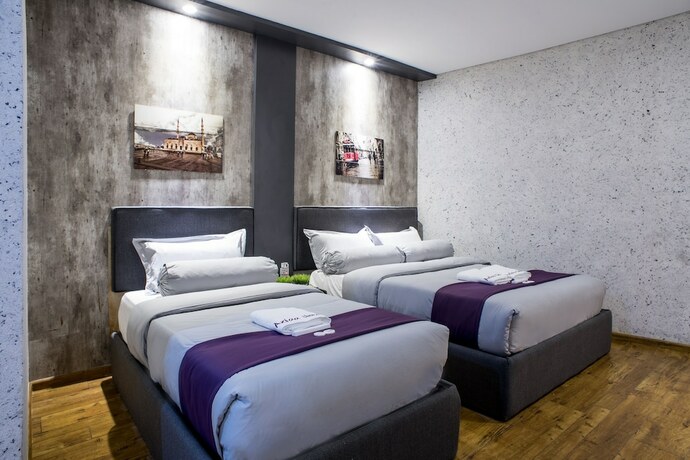 Imagen de la habitación del Hotel Axiaa Hotel. Foto 26