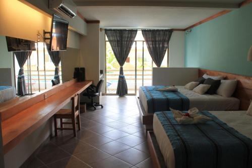 Imagen de la habitación del Hotel Axkan Tulum. Foto 8